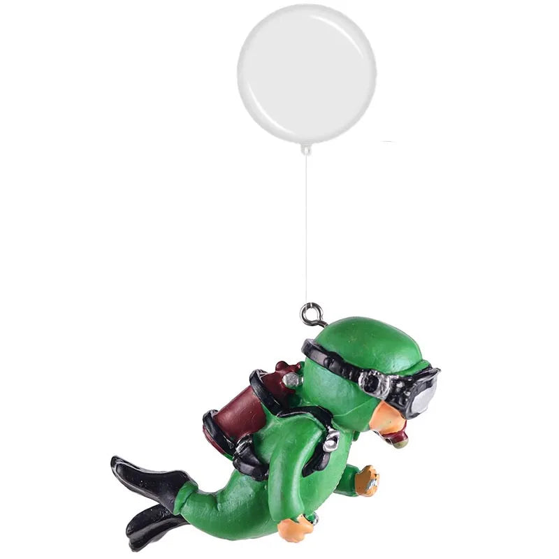 A green resin mini diver aquarium ornament is suspended by a white balloon.