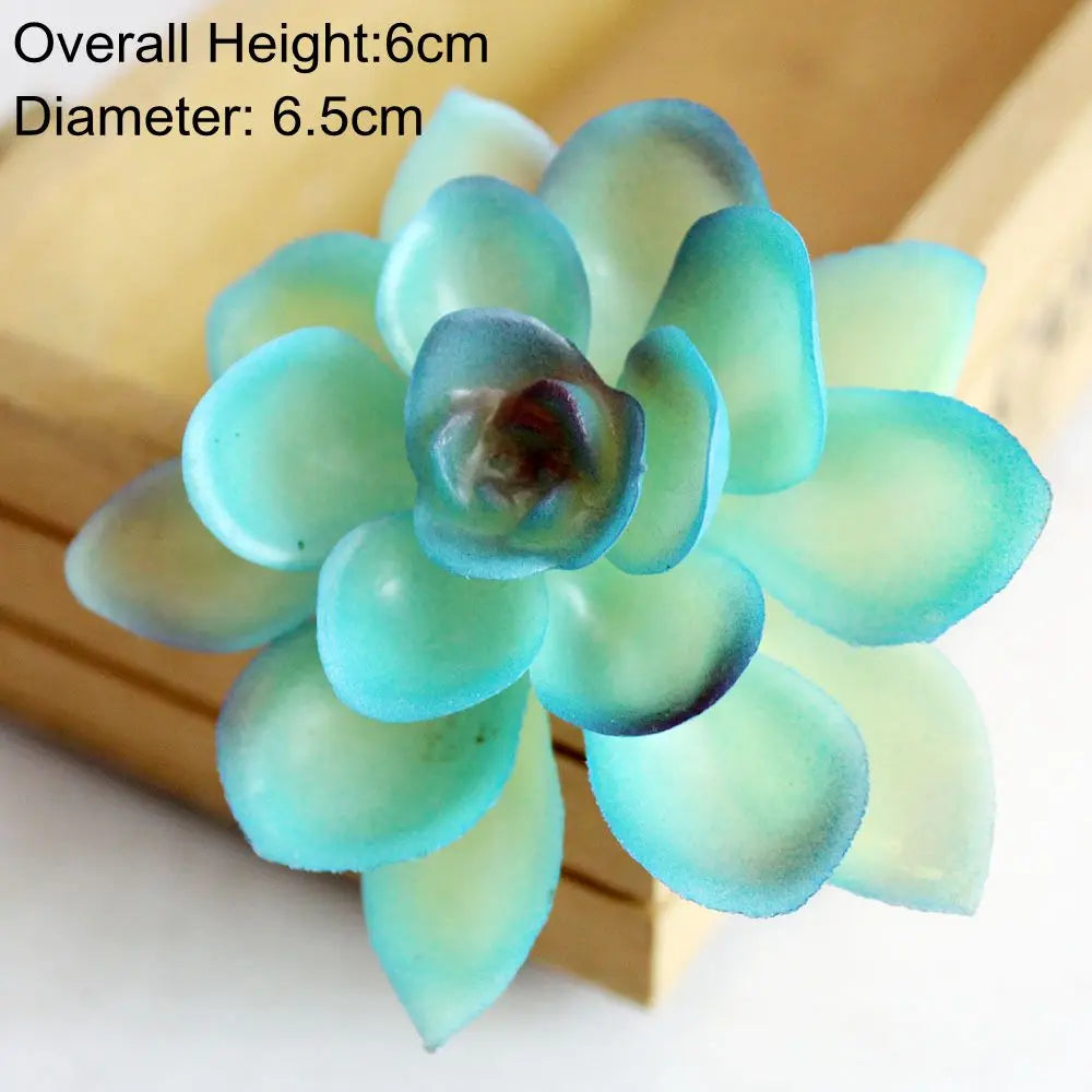 A cluster of light blue artificial succulent plants with green stems displayed on a wooden surface.