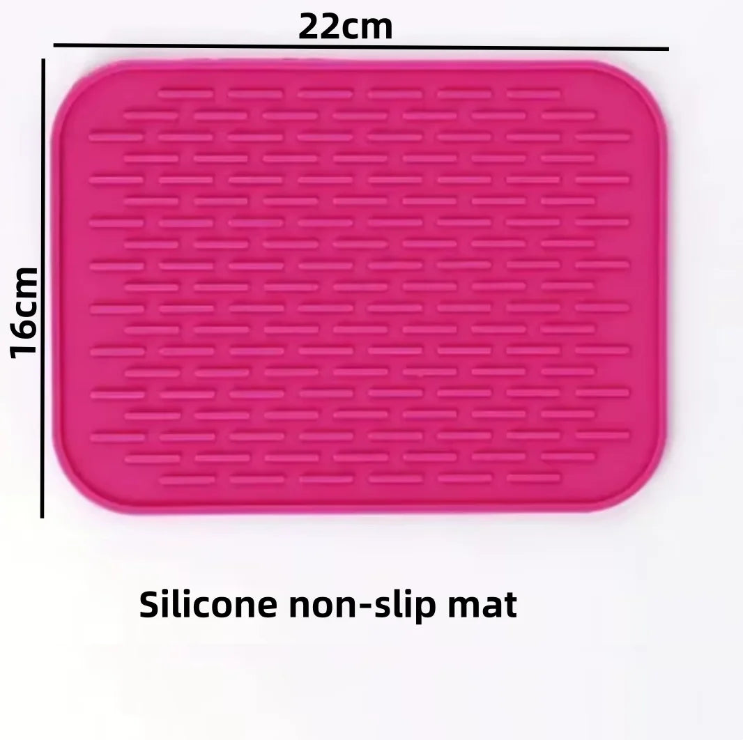 A pink silicone non-slip mat measuring 22cm by 16cm for pet feeding.