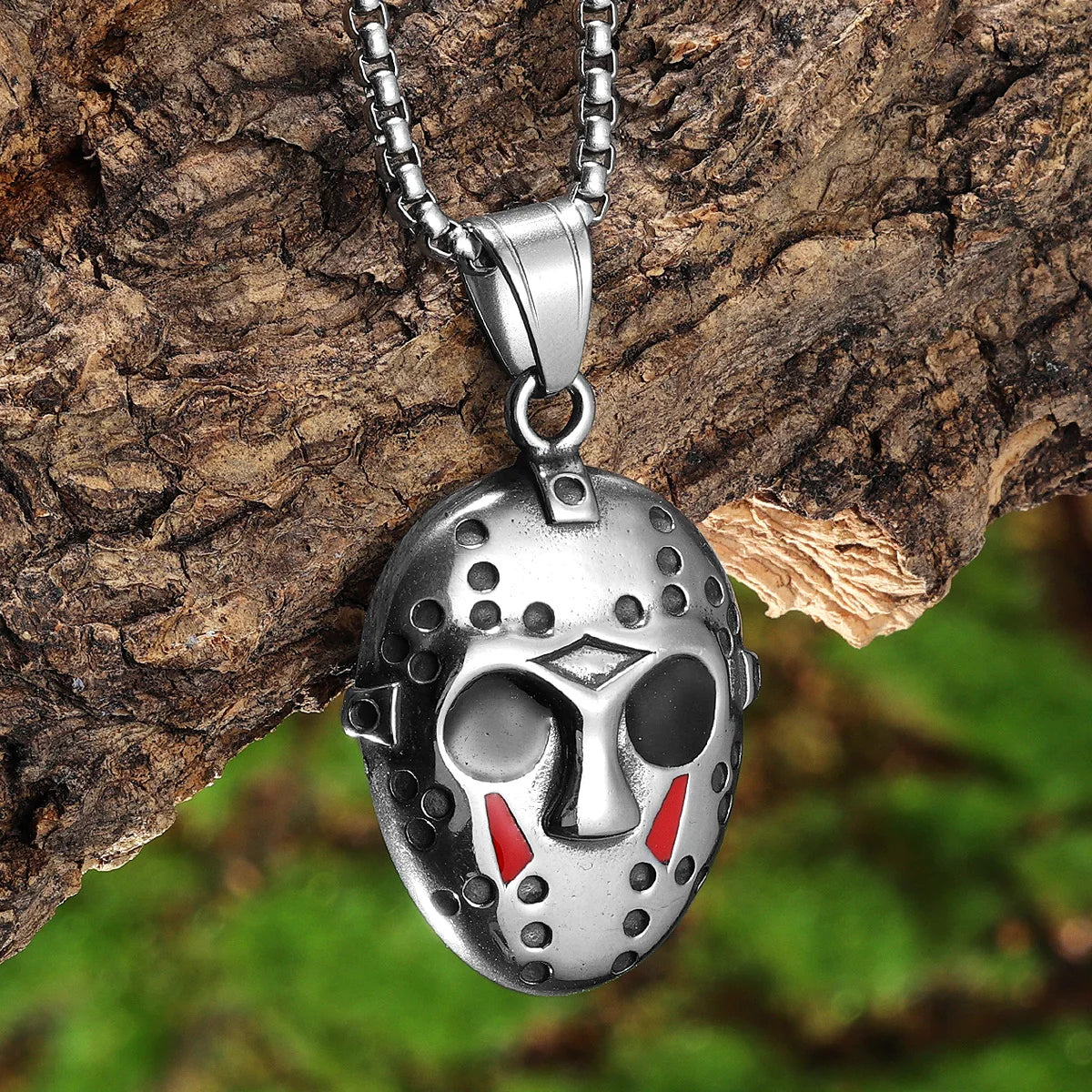 A silver stainless steel pendant necklace featuring a Jason Mask face design.