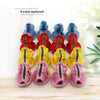 Set of four breathable summer dog shoes in blue, red, yellow, and pink colors displayed on a wooden surface.