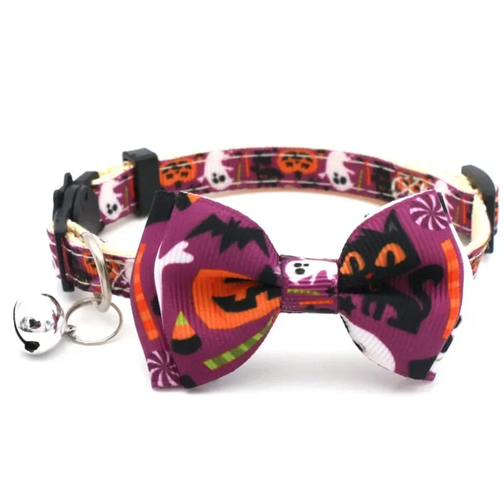 A purple and orange Halloween cat collar with a bow tie and bell, featuring a breakaway safety buckle.