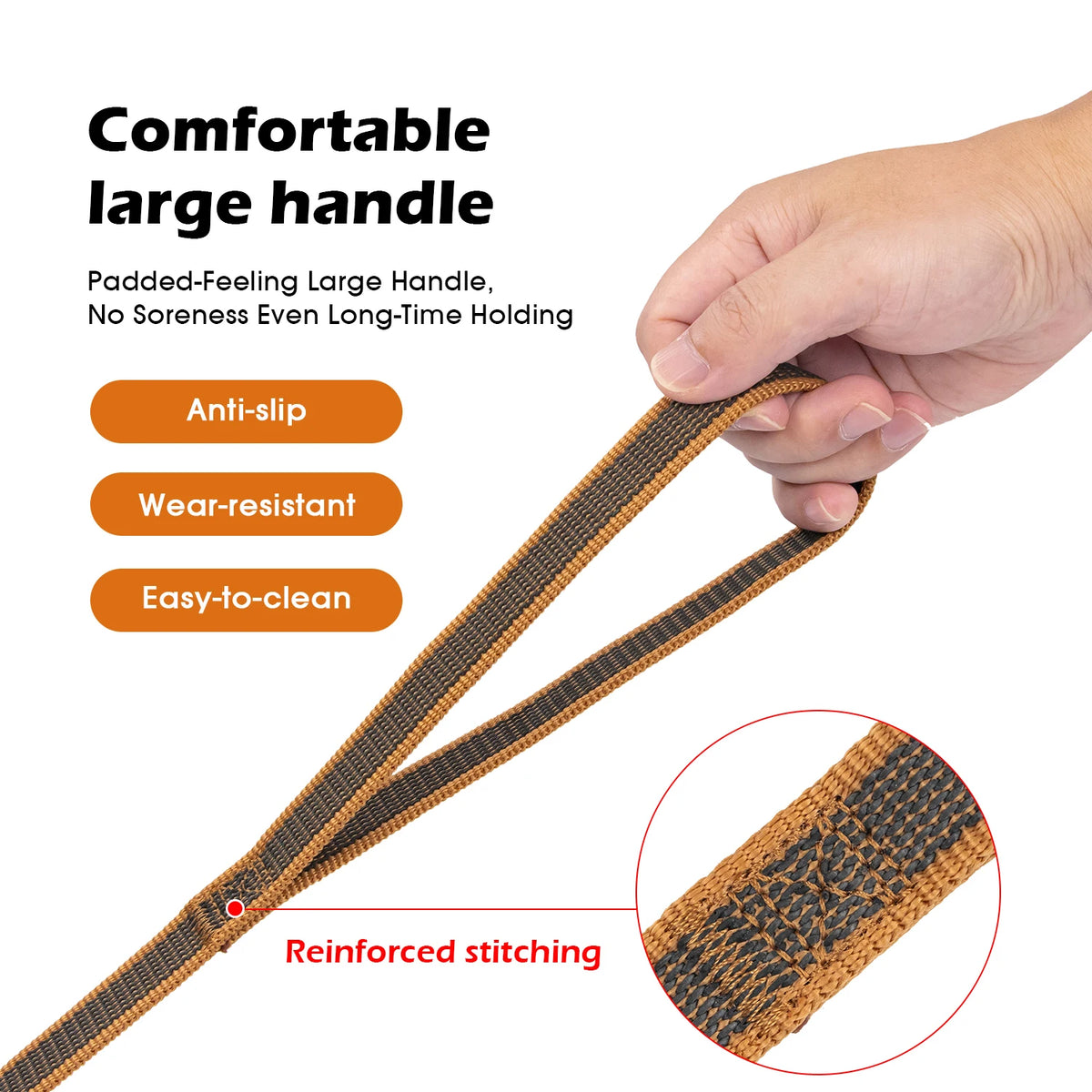 Close-up of a brown padded dog leash with reinforced stitching shown being held by a hand.
