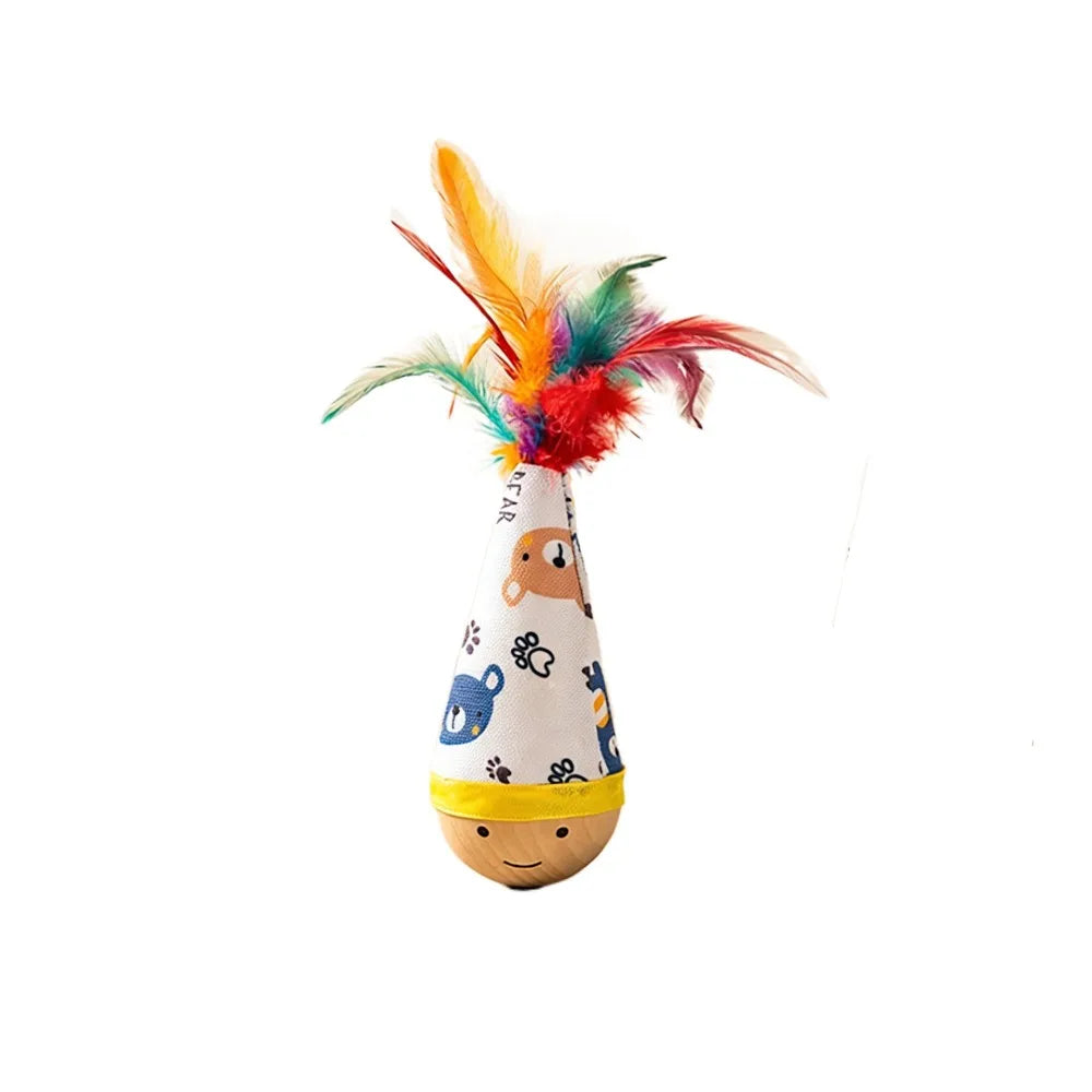 A colorful cat feather wobble toy with a paper cone base and a fluffy feather attached.