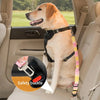A golden retriever wearing an adjustable traction rope safety harness sitting in a car seat.