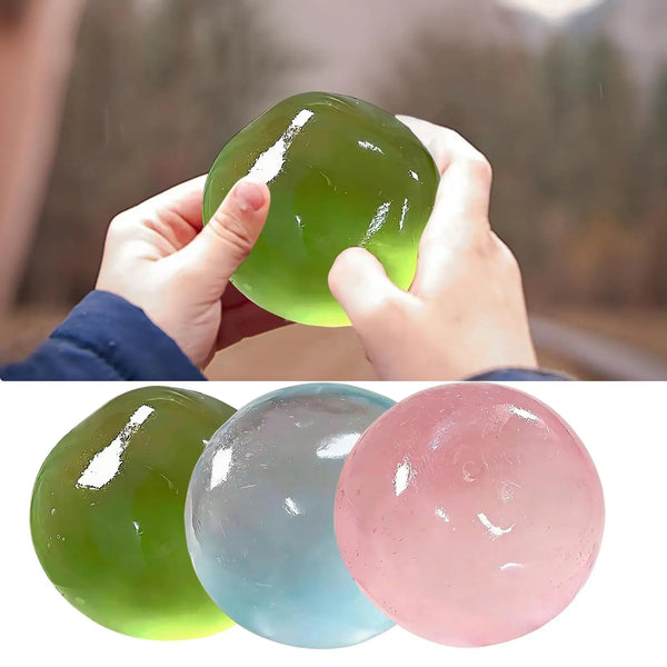 Three soft silicone stress balls in green, blue, and pink are shown against a white background.