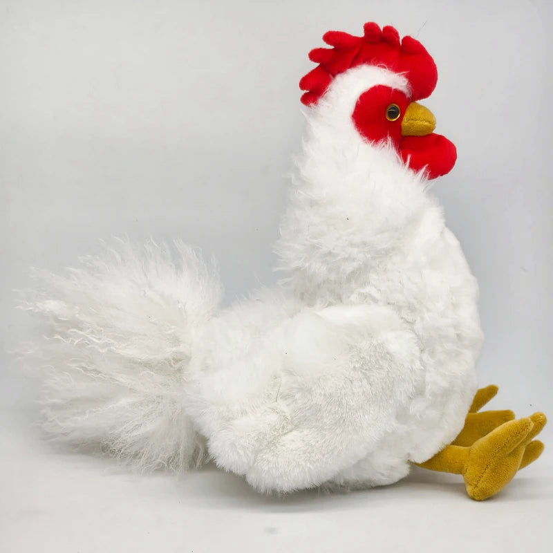 A white plush rooster and hen set with red comb and beak, lying down on a light background.