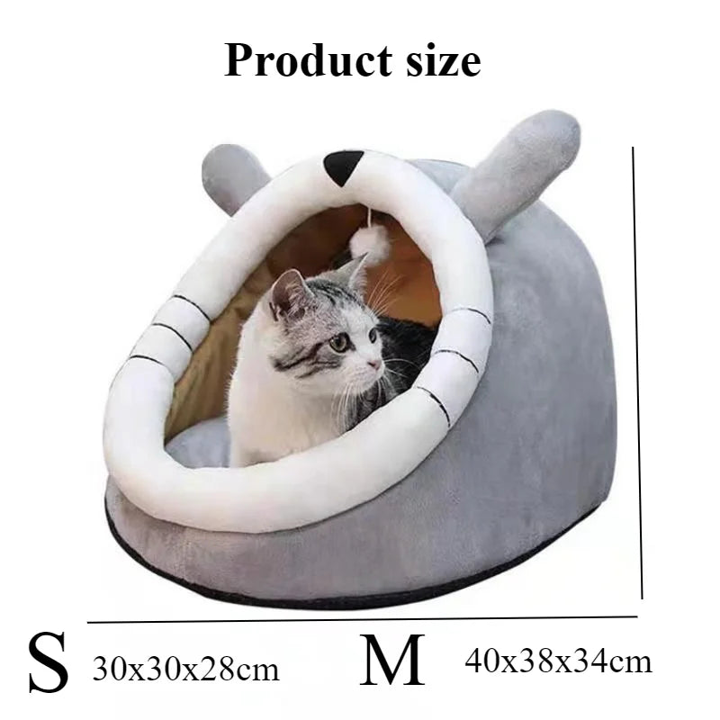A gray cat is inside a round, soft pet cave bed designed for cozy resting.