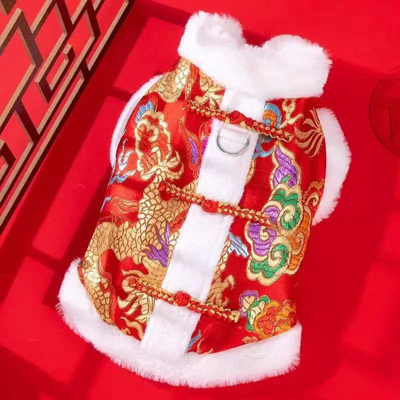A red and gold Chinese style tang suit dog coat with white trim and fur lining.