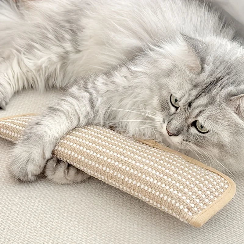 A fluffy gray cat is relaxing on a beige hemp scratching pad and lounger.