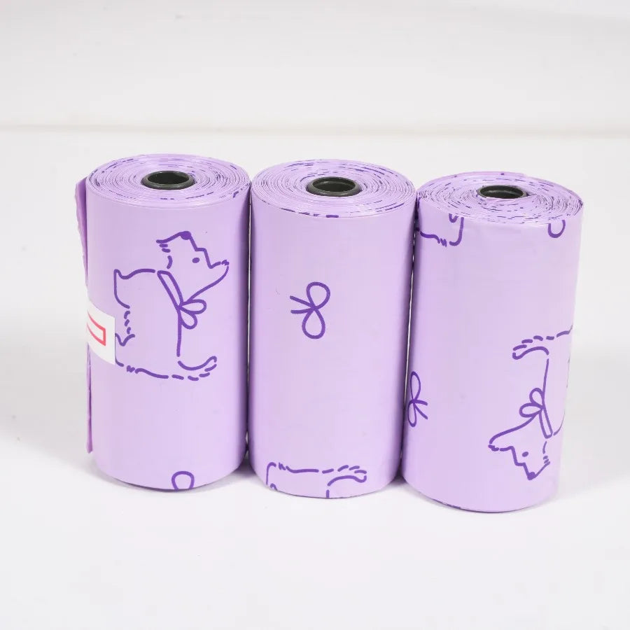 Three rolls of purple thick dog waste bags featuring mixed sweet patterns.