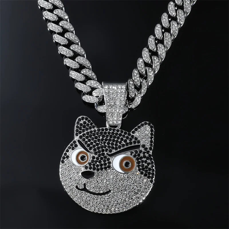A silver iced out letter and animal pendant Cuban link chain necklace featuring a tiger face.