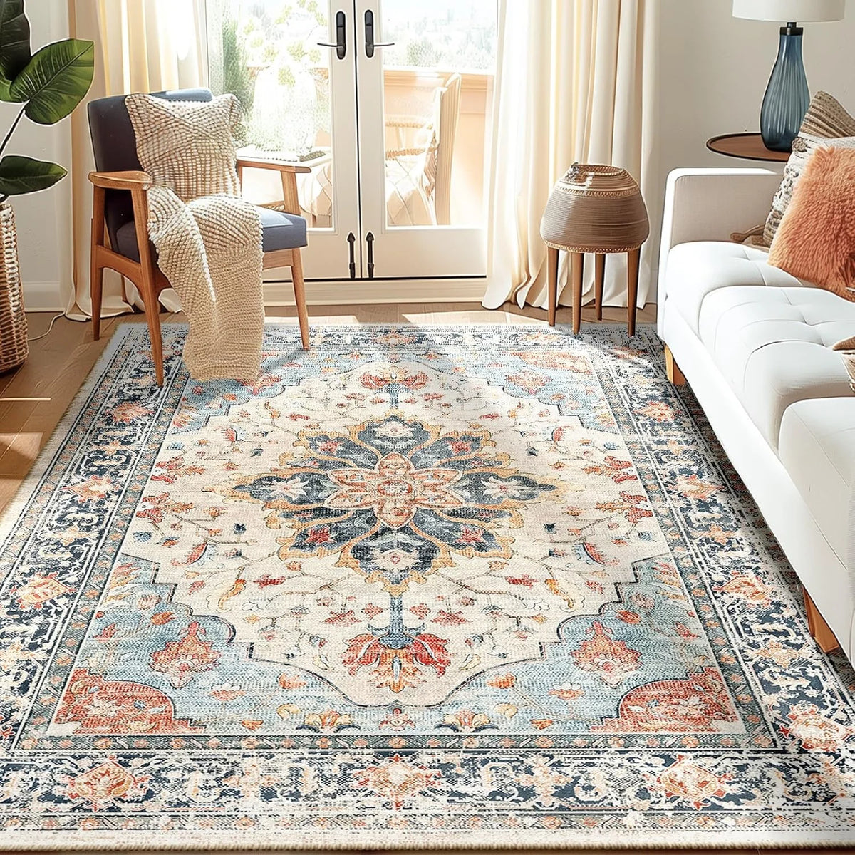A detailed bohemian Persian floral area rug featuring blue, beige, and rust tones in a traditional medallion pattern.