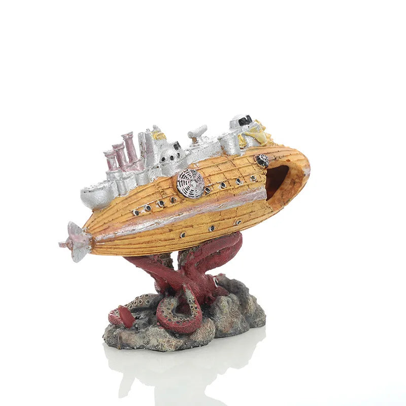 A model ornament depicting a sunken submarine with a hideout cave, mounted on a rocky base.