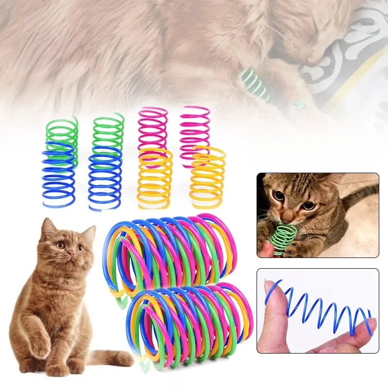 A collection of colorful durable cat spring toys in various colors and sizes, shown alongside a tabby cat.