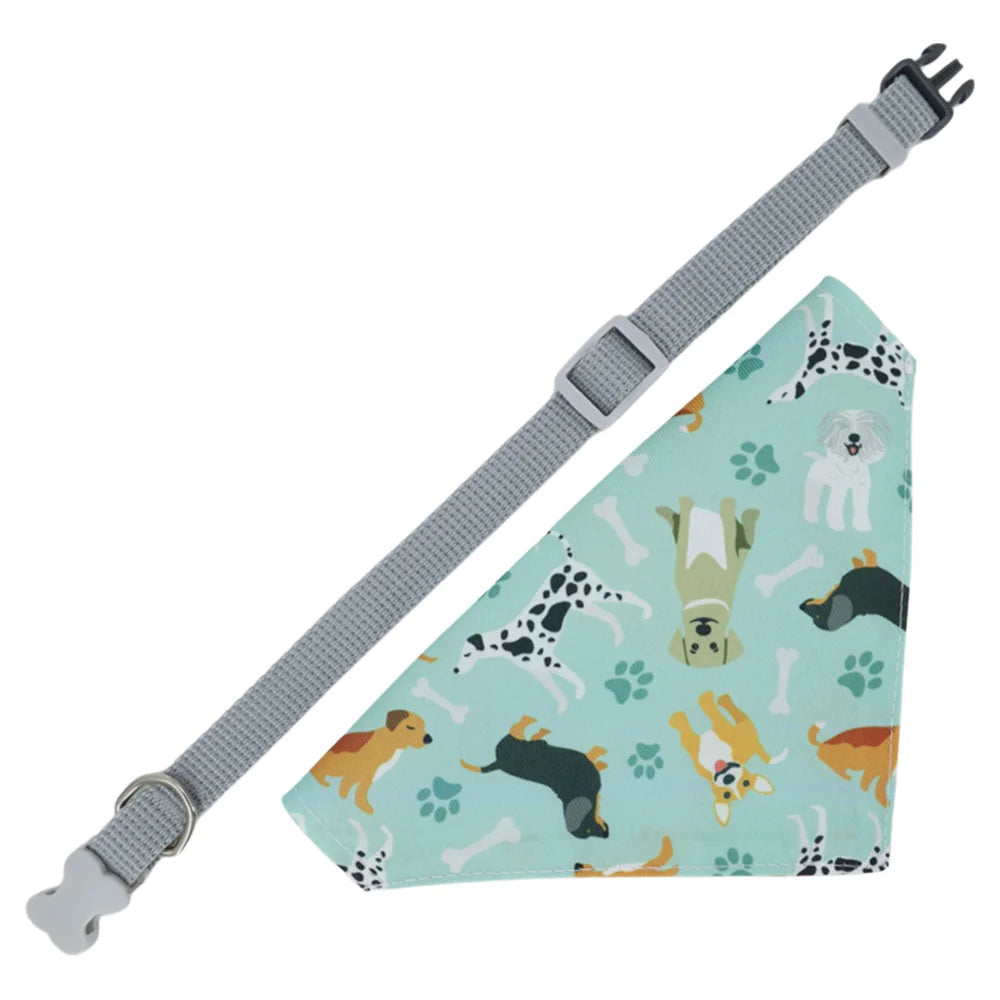 A light green cotton pet bandana with a cartoon print of various animals and bones, attached to a gray adjustable strap.