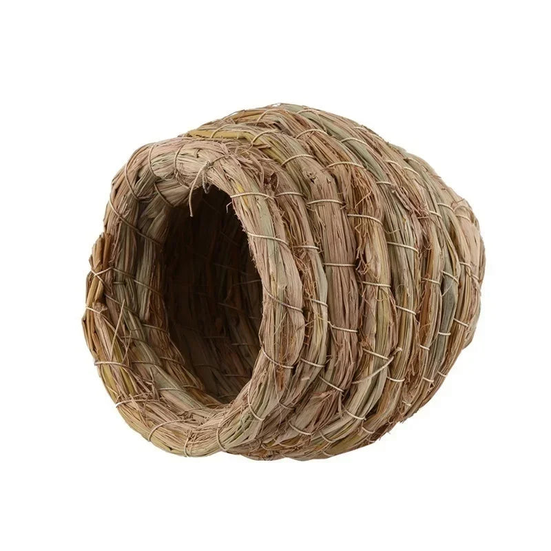 Handwoven straw bird nest for small birds, cylindrical in natural brown and tan tones.