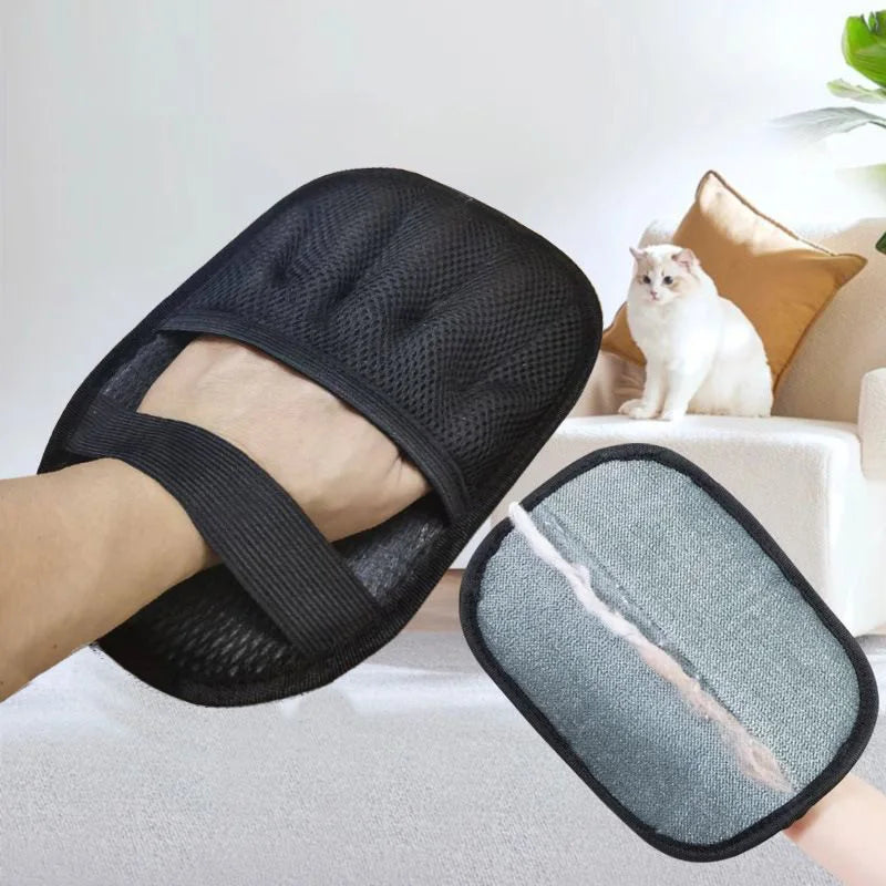 Black reusable pet grooming gloves with a mesh texture shown on a person's foot.