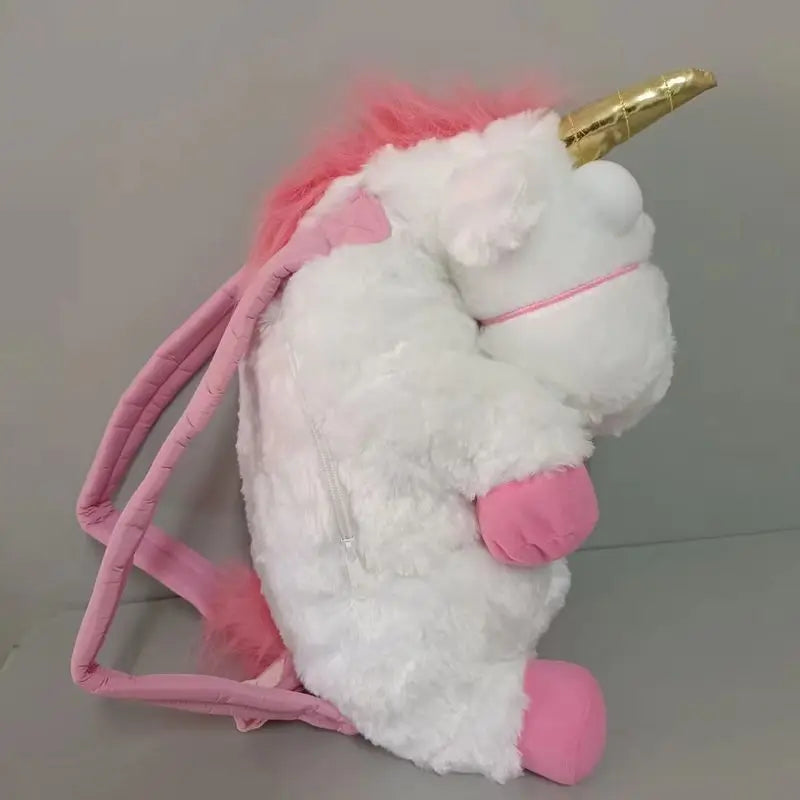 A white unicorn plush doll with pink accents and a gold horn, featuring a pink strap or backpack charm.