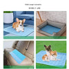A pet mat is shown in various usage scenarios, including on a sofa, in a brick setting, and outdoors on grass.