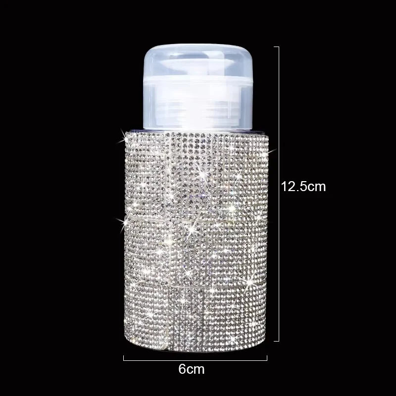 A clear pump bottle filled with sparkling diamond-patterned glitter, used for nail polish remover or makeup.