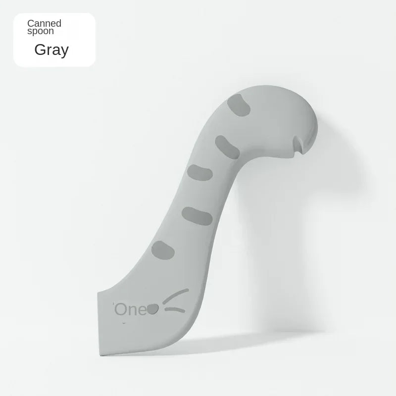 A gray multifunctional pet feeding spoon with a serrated edge and a sealing lid.