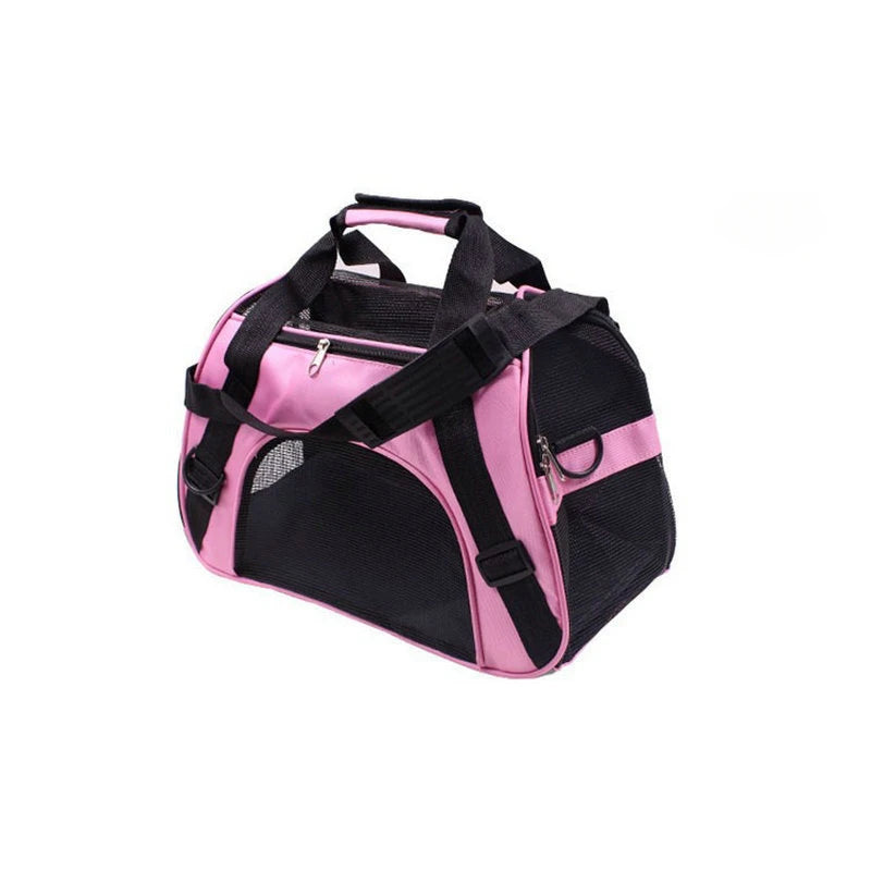 A pink and black breathable soft-sided pet carrier bag with padded straps.