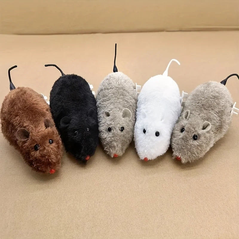 A collection of five wind-up plush mouse toys in various colors including brown black gray white and light gray.