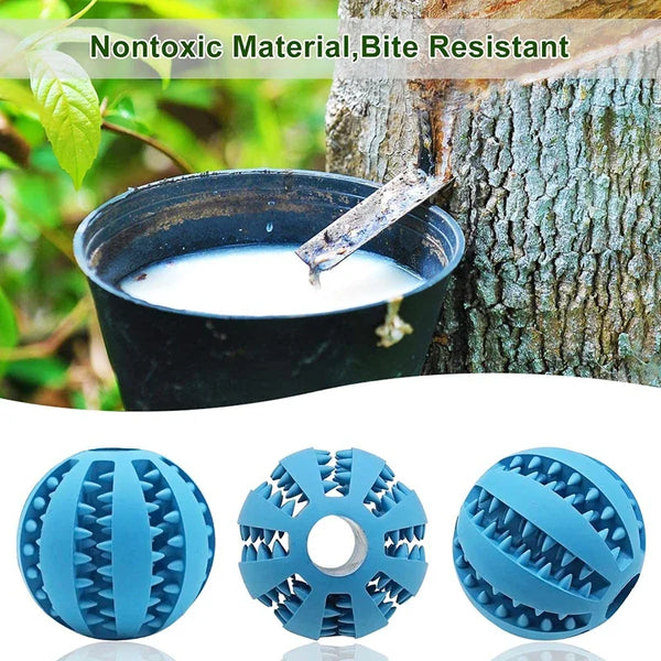 Blue natural rubber treat dispensing balls for dogs shown next to a tree trunk.