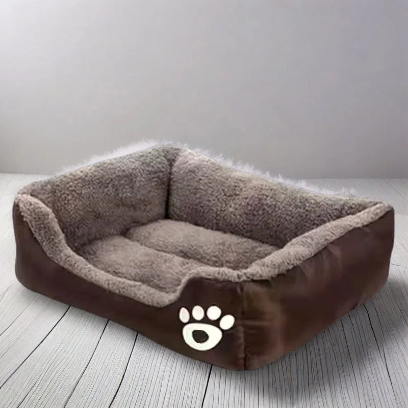 A brown dog bed with a plush, fluffy cushion and a paw print design on the front
