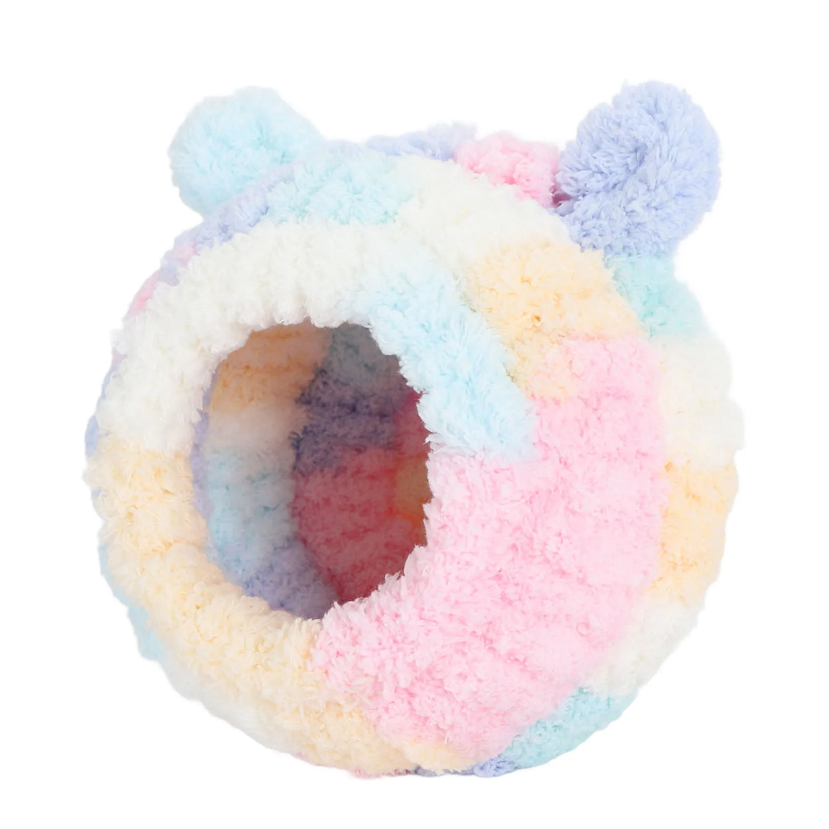 A fluffy, round bird nest bed with pastel pink, blue, and purple textures.