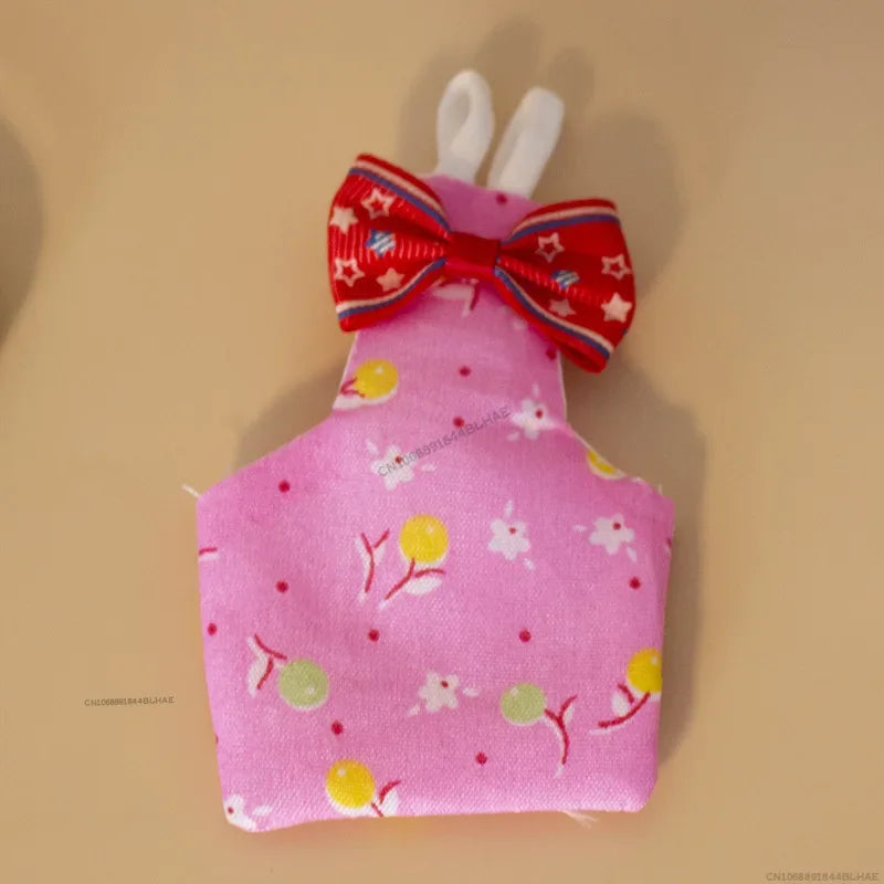 Pink parrot flight suit with a red bow tie and white trim