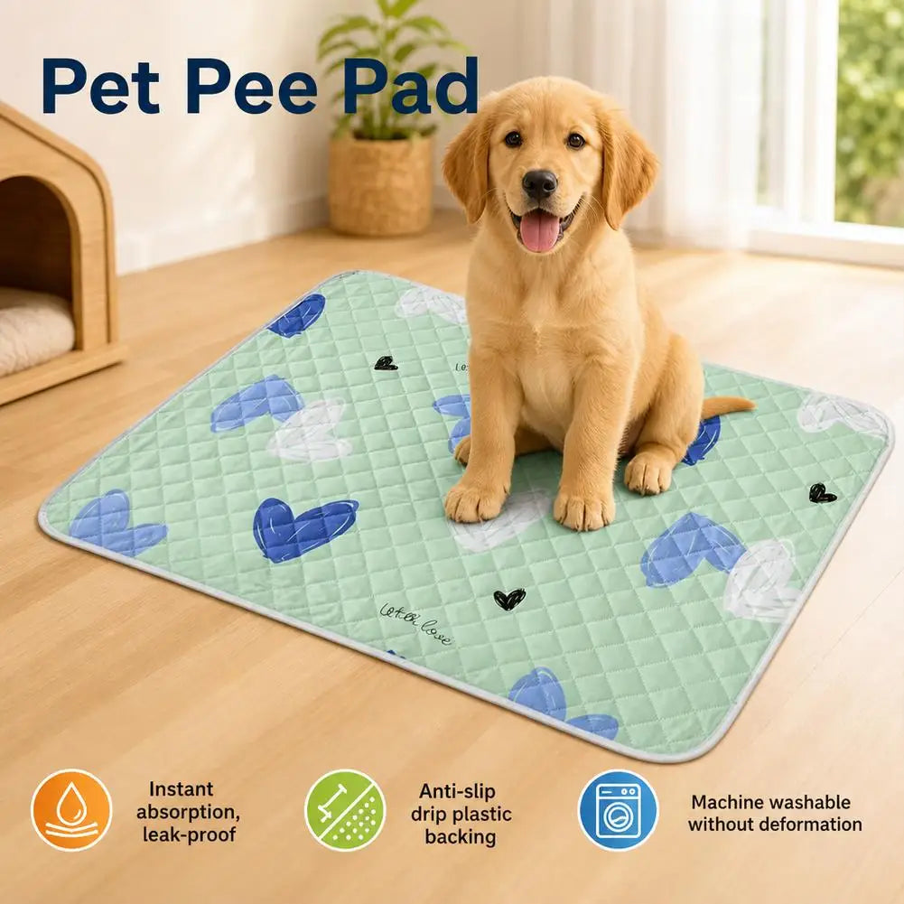 A light green pet pee pad with blue and white hearts is shown on a wooden floor, next to a golden-colored dog.