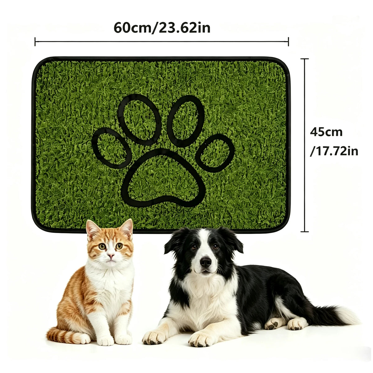 A green dog training mat with a paw print design next to two dogs.