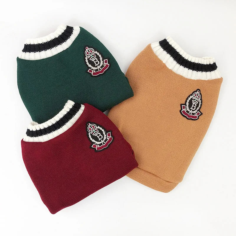 A set of three cozy cotton pullover sweaters for pets in shades of dark green, tan, and maroon.