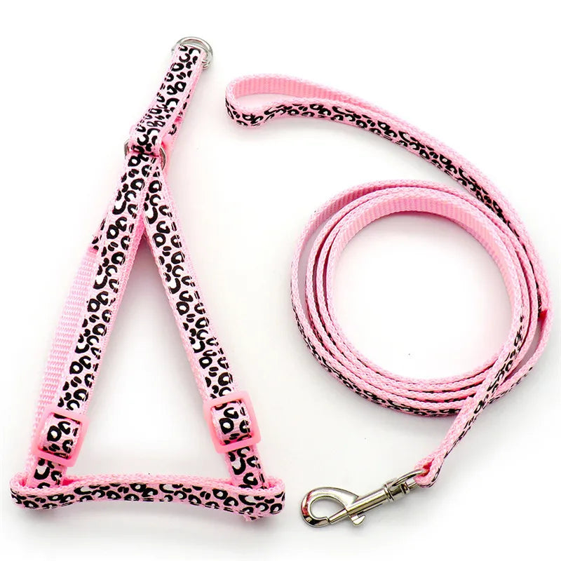 Pink adjustable dog harness and leash with a black leopard print pattern
