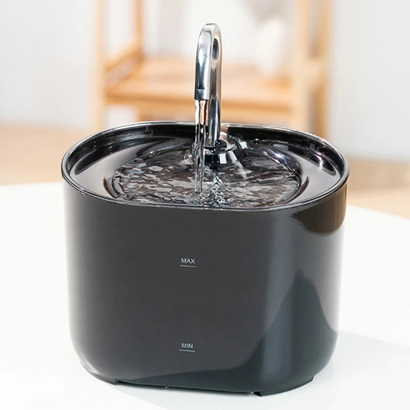 A black cat water fountain with a stainless steel faucet is shown, featuring MAX and MIN settings.