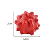 A bright red, spherical dog chew toy with prominent bumps and ridges.
