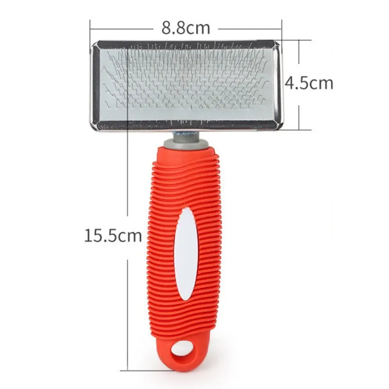 An orange silicone cat comb with stainless steel pins for gentle pet grooming, shown with dimensions.