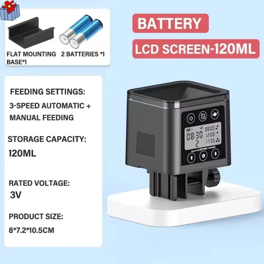 A black automatic fish feeder with an LCD screen and battery, shown on a white base.