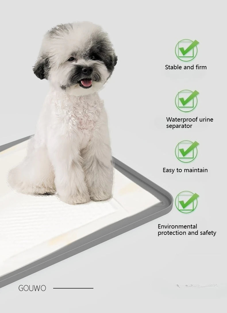 A fluffy white dog is sitting on a silicone pee pad holder with raised edges, demonstrating its stability and features.