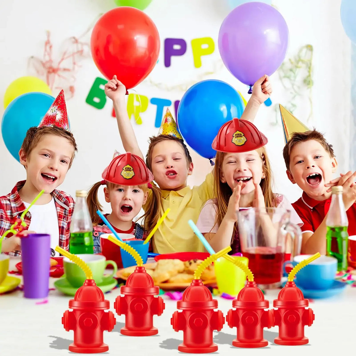 Red fire hydrant shaped straw cups with lids for kids used in a birthday party setting