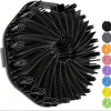 Black silicone exfoliating brush with numerous bristles and colored silicone scrubbing pads