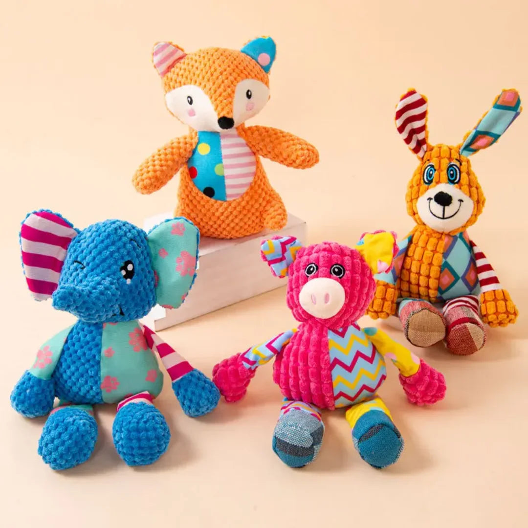 A collection of three squeaky plush toys featuring fox, elephant, and puppy designs.