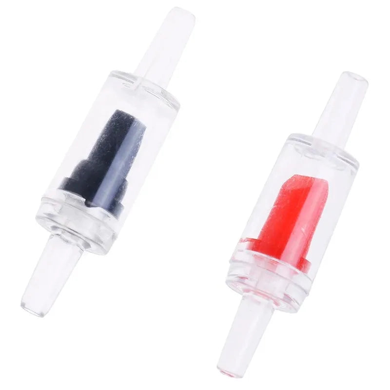 A clear plastic aquarium air pump check valve with a black and red internal component.