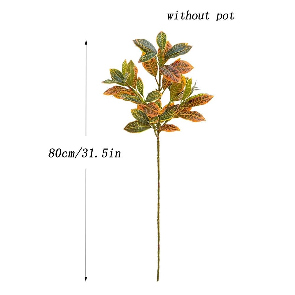 Artificial croton tree with vibrant orange and green tropical leaves shown without a pot.
