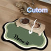 A pet feeding mat featuring a cute cat and a dog paw print, designed for feeding seeds or dry food.