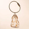 A clear glass charm shaped like a striped cat is attached to a braided leather keychain.
