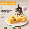 A yellow felt cat box puzzle maze for cats with a fluffy pink ball and small balls.