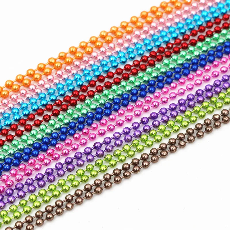 A colorful ball necklace set featuring strands of gold and silver-plated beads in various shades.